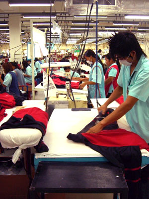 Workers on the line at Nice Apparel in Bangkok produce garments under license to brands such as Nike and Under Armour for the American market, 2007. Photo Credit: Center for Southeast Asian Studies, University of Michigan
